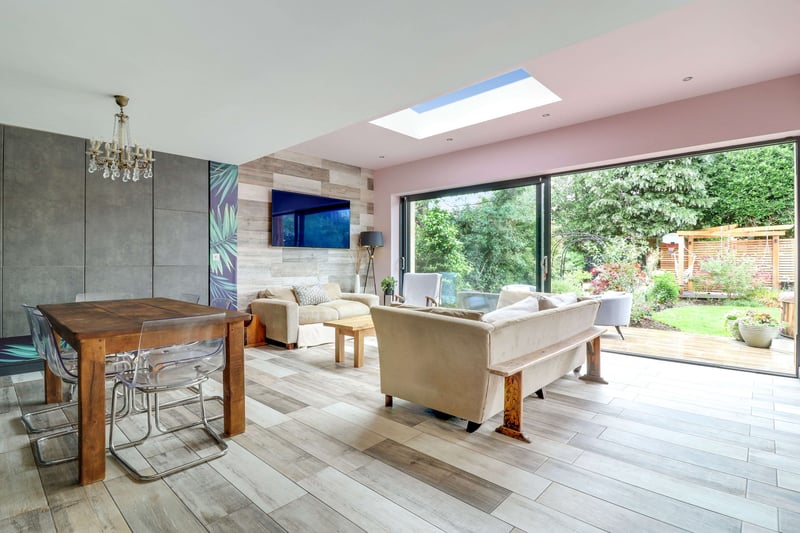 The house has an open plan dining space and living area with large format tile floors. Aluminium sliding doors to rear and side of property giving a real sense of space to relax and entertain.