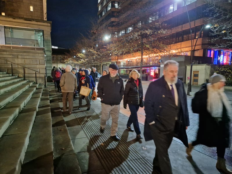 Sheffield was packed as thousands headed for the city centre for the recording of the Christmas Songs of Praise. Crowds queue near  Barkers Pool. Picture: David Kessen, National World