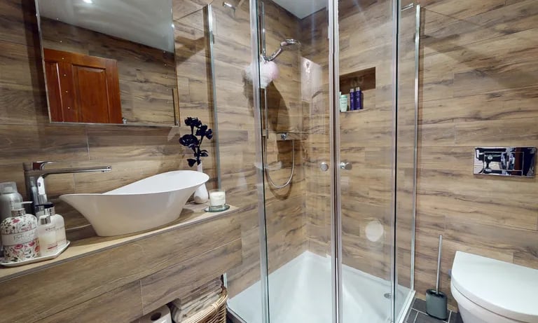 A stunning family bathroom with shower.