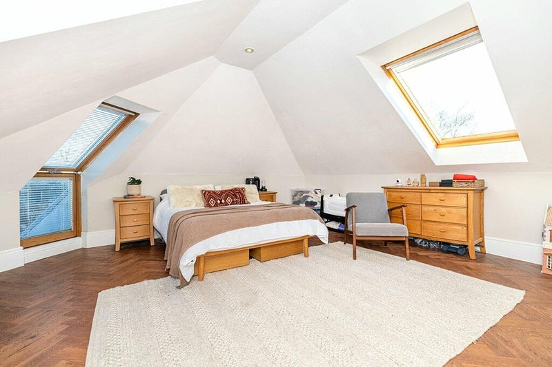 Bedroom one has three velux windows and direct access to the roof terrace. 