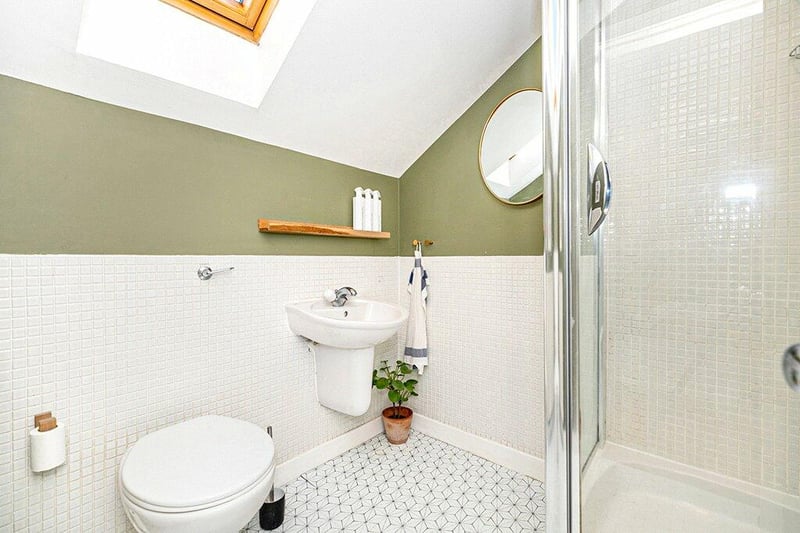 The en suite shower room is accessed from bedroom one and features a velux window. 