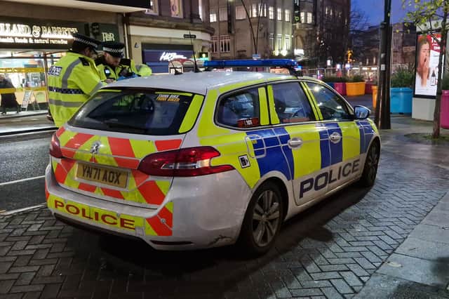 Police take a suspect to their car at Barker's Pool in Sheffield city centre, during an Operation Calibre patrol. Picture: David Kessen, National World
