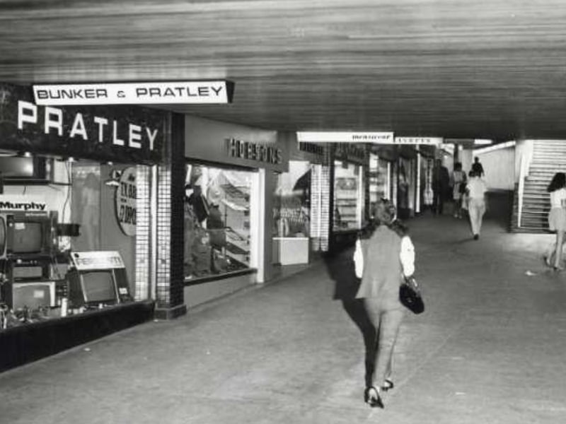Window displays at shops in the south east subway of Sheffield's Hole in the Road in 1969, including Bunker and Pratley television dealers and Wm. Hobson and Sons outfitters