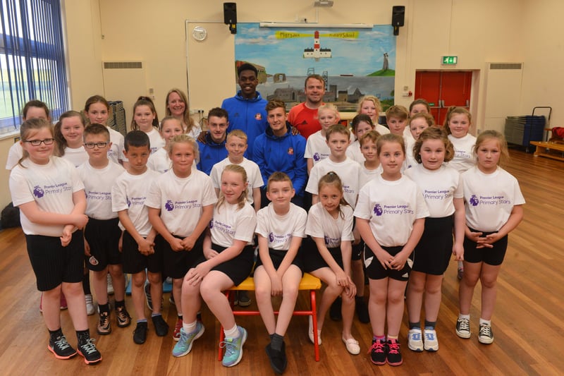 Sunderland players visited Marsden Primary School to promote the Premier League International Cup Final in 2017.
Pictured are, back row from left, headteacher Caroline Marshall, and SAFC players Elliot Embleton, Joel Asoro, Ethan Robson and coach Steve McClarence with the pupils.