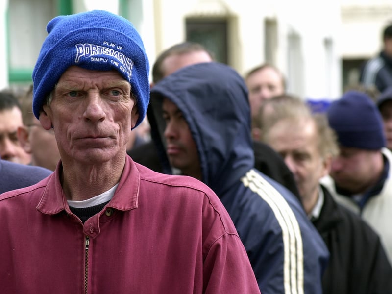 In 2003, Pompey fan of 48 years, John Withers, from Gosport, waits with other fans in the ticket queue at Fratton Park hoping to obtain tickets for the end of the season Bradford game. This picture was taken at 12.50pm and Mr withers had been in the queue since 5.30am.