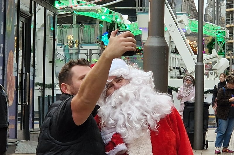 A member of the public catches a selfie with Santa himself of The Moor.