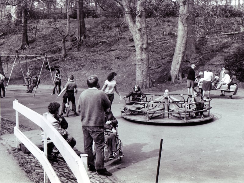 Old style play equipment remained in the he playground at Forge Dam, Sheffield, in April 1982, and elsewhere in the city. There was no soft landing if you fell off those roundabouts
