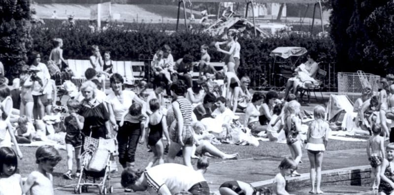 Families at Millhouses Park paddling pool in June 1982 