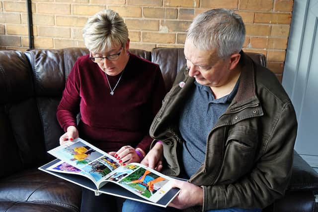 Parents of Gracie Spinks - Richard Spinks and Alison Heaton, looking at pictures of their daughter. Picture: Brian Eyre, National World
