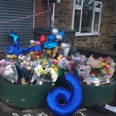 Flowers, balloons, candles and letters have been left at the scene of a fatal collision in Sheffield