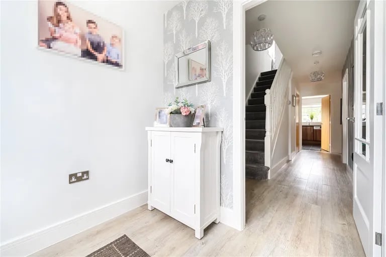 Enter into a spacious bright hallway with stairs to the first floor and a guest WC.