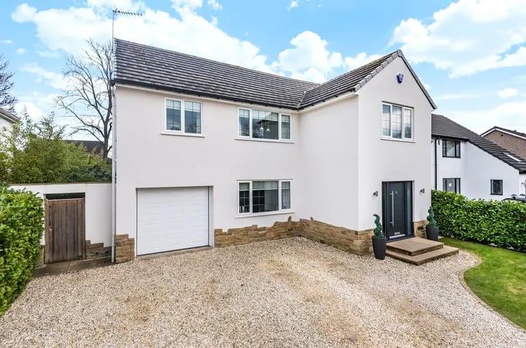 This luxurious four bedroom detached house on St. Helens Gardens in Adel is on the market with Manning Stainton for £750,000.