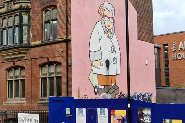 Pete McKee's famous 'Muriel' mural on Carver Street, Sheffield, is back, after being covered up by mobile buildings. Picture: David Kessen, National World