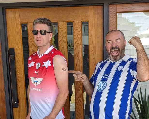 Barnsley fan Mark Myers (left) with his Owls tattoo which he got after losing a bet with his Sheffield Wednesday-supporting friend Steve Gosling (right)