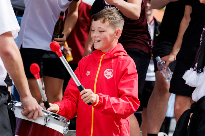 A young Jambos fan beats the Gorgie Ultra drums. 