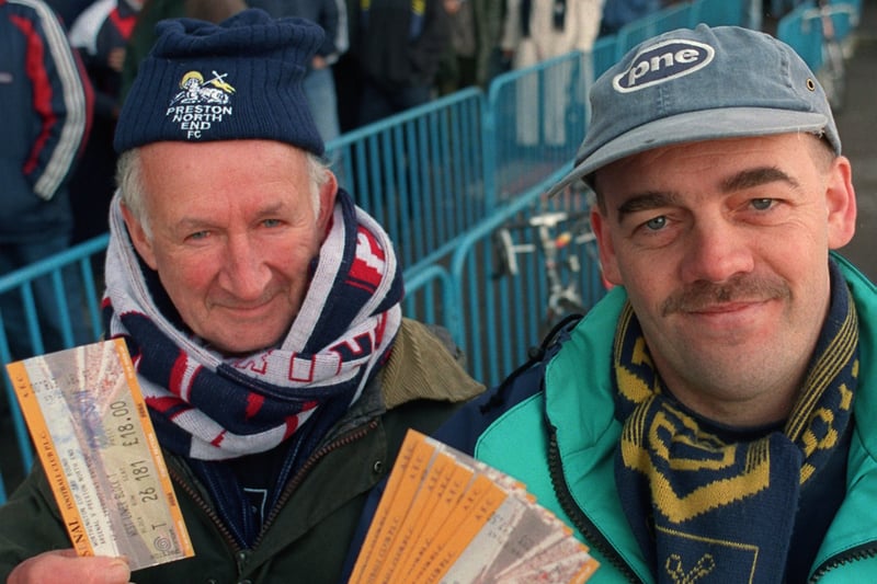 Preston North End fans Cyril Ashcroft, left, and Mark Carroll show off their tickets for Arsenal's FA Cup third-round trip to Deepdale in January 1999 after joining the queue early in the morning.