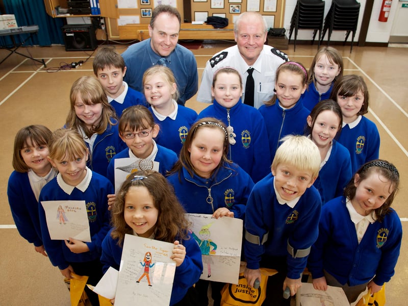 Mr Hynd, headteacher of Emmanuel Junior School, in Waterthorpe, Sheffield, with Chief Inspector Robin Caulfield and pupils, who were celebrating success after winning the Inside Justice Week competition run by South Yorkshire Criminal Justice Board