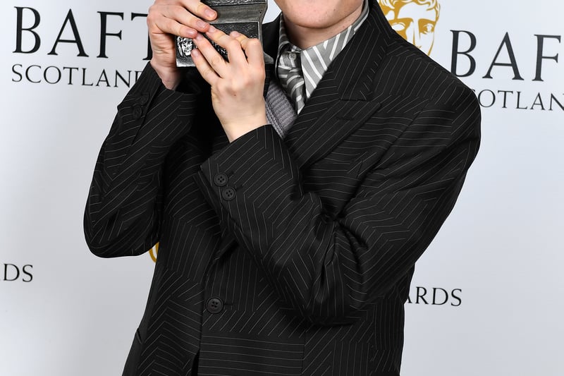 Lewis Gribben with the award for Actor Television Award for 'Somewhere Boy' during the 2023 BAFTA Scotland Awards