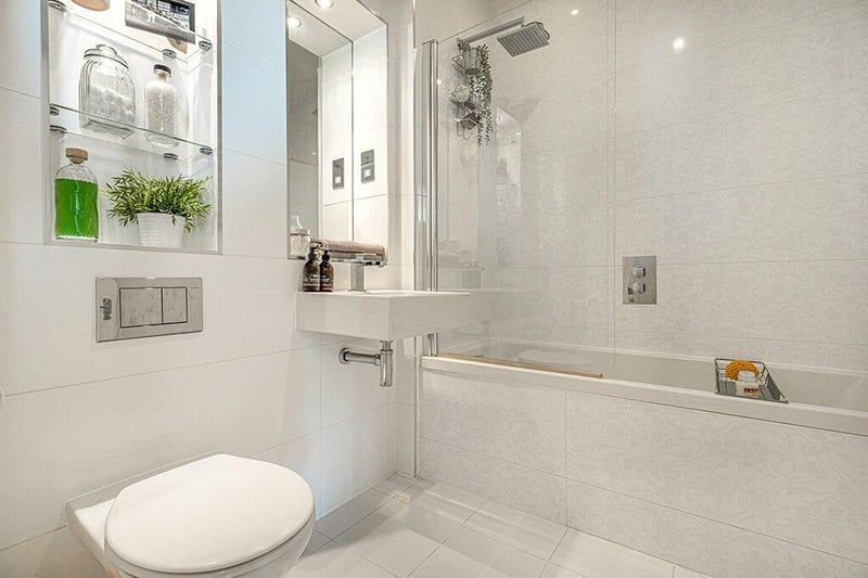 The main bathroom is a three-piece suite that is also designed by Porcelanosa. 