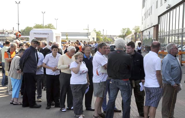 Blackpool fans queue for season tickets in May 2010 after the Seasiders' promotion to the Premier League