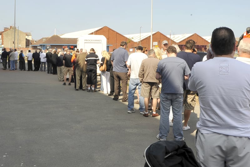 The queue outside Bloomfield Road in 2010 as fans look to snap up 2010-11 Premier League season tickets.