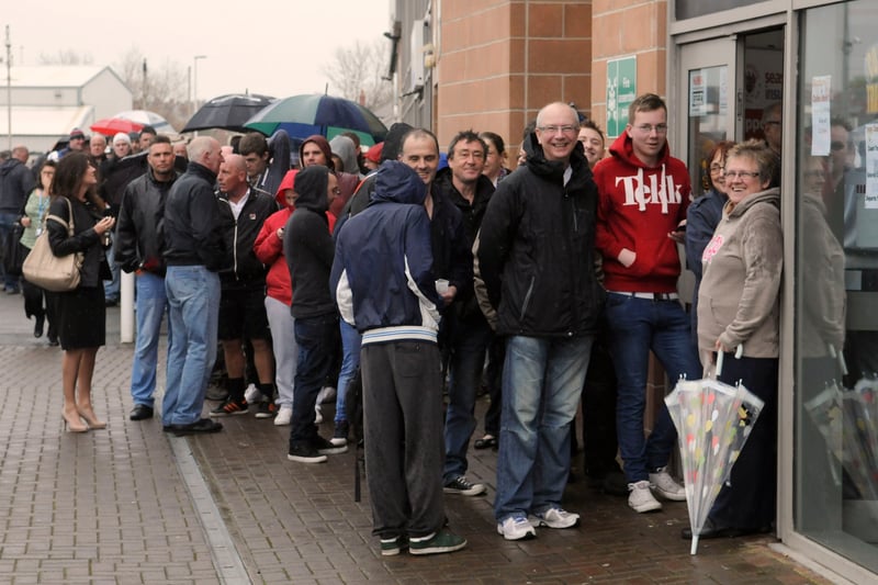Blackpool supporters queue for tickets for the Seasiders' trip to Wigan on the penultimate day of the 2013-14 Championship season