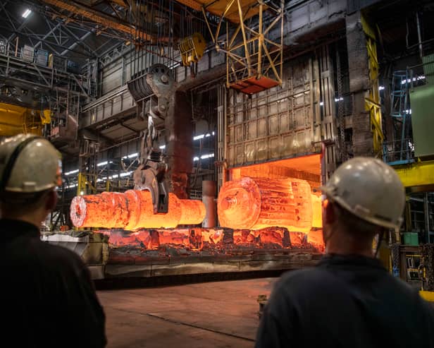 A large ingot and a 50 tonne back up roll for the steel processing industry come out of the furnace at Forgemasters.