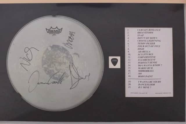 This is the grand prize - a signed drum skin, a plectrum and the physical set list, all from the Arctic Monkeys' June 9, gig at Hillsborough Park, 2023.