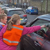 Youngsters on patrol outside Westways Primary school in the new Good / Bad Parking scheme, Picture: David Kessen, National World