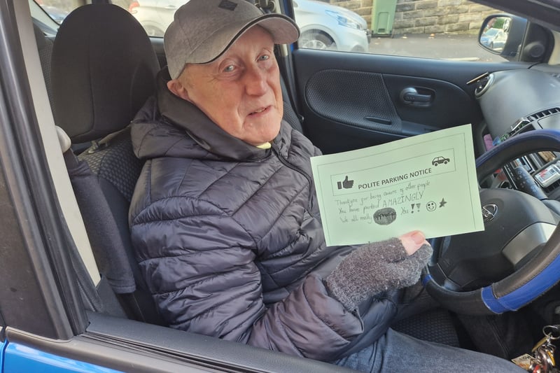 A motorists handed a green notice for good parking. Picture: David Kessen, National World