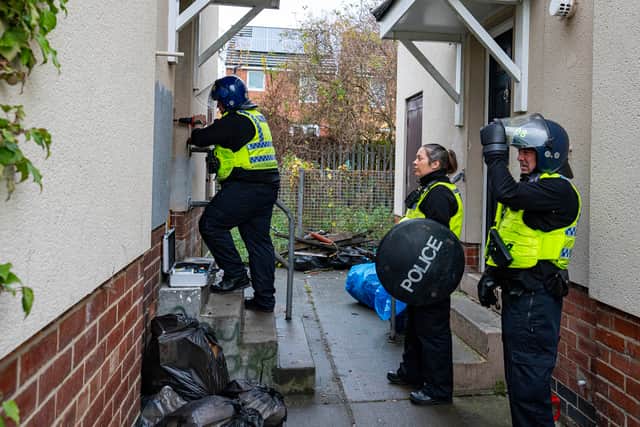 Officers enter an address as part of a previous Operation Sceptre day.