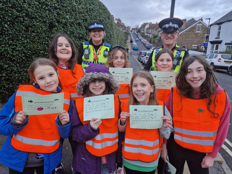 Youngsters on patrol outside Westways Primary school in the new Good / Bad Parking scheme, with the tickets they gave out. Picture: David Kessen, National World