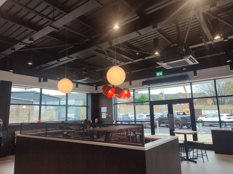 The interior is tastefully decorated with oversized hanging lamps and moon-like orbs that provide mood lighting