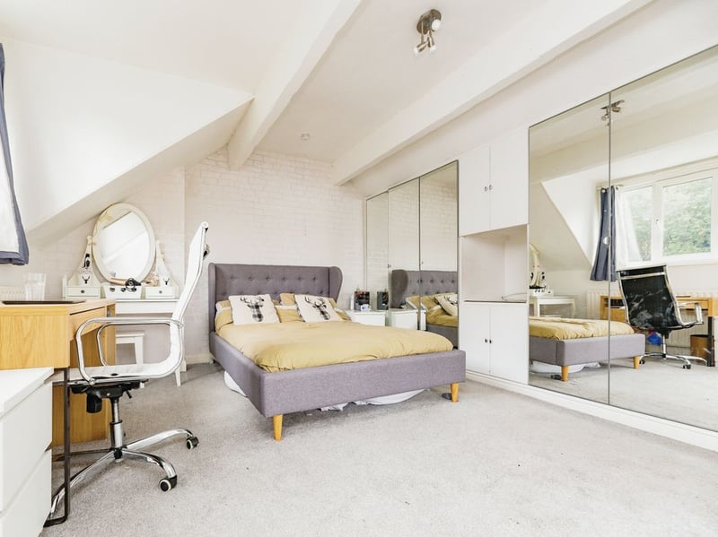 This loft master bedroom has plenty of space and built-in storage. (Photo courtesy of Purplebricks)