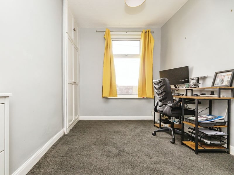 Bedroom three, positioned to the front of the first floor, is currently utilised as an office. (Photo courtesy of Purplebricks)