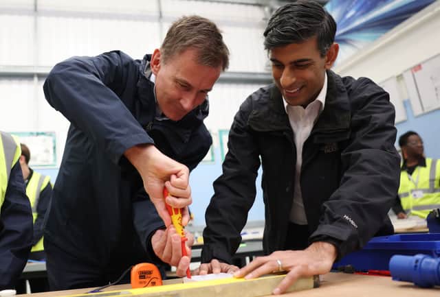 Jeremy Hunt and Rishi Sunak at a college visit. Credit: Getty
