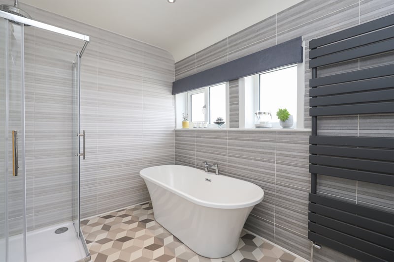This contemporary bathroom is one of two in the house. (Photo courtesy of Redbrik)