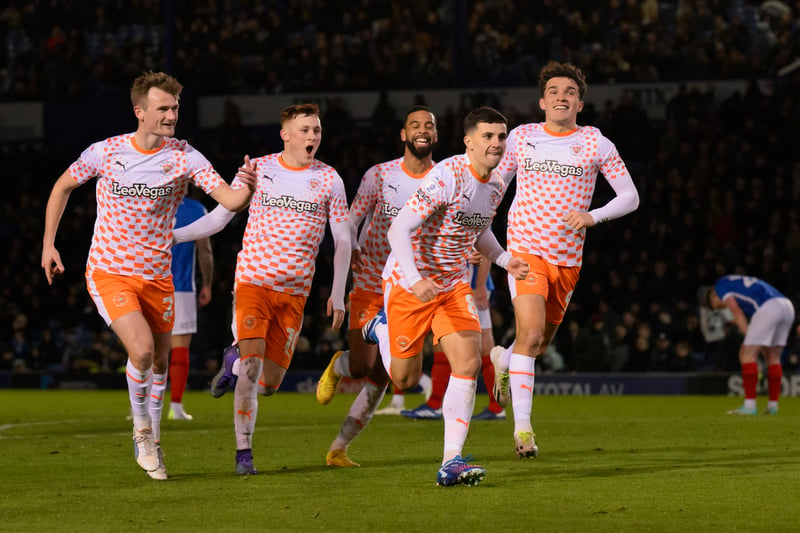 The Blackpool players celebrate substitute Albie Morgan's goal in front of the travelling Seasiders fans.