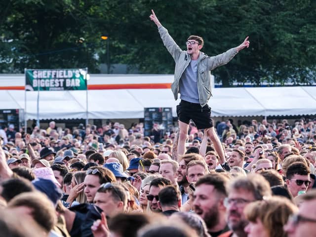 A reveller is held up above the crowd during the 2023 Tramlines Festival at Hillsborough Park, Sheffiel. Bosses have issued an update on sales for the 2024 show. PIcture: Dean Atkins, National World

