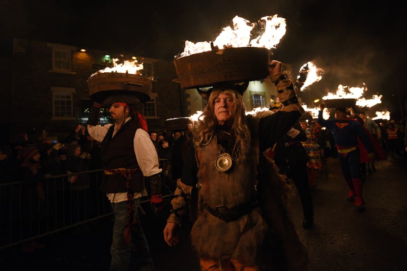 The New Year's Eve blazing barrels parade is one of the North East's oldest and most unusual festive customs, dating back at least 160 years, though said to date from the Middle Ages. 

The Tar Bar’l sees crowds gather from 11pm in the town centre to see the guisers called upon to do their duty. At 11:30pm, the torches are lit and the barrels ignited. Each guiser lifts the flaming barrels up onto the top of their heads and fall in behind a band. At midnight, the procession arrives at the Bar’l fire in the town centre. 

The barrels are then used to ignite this ceremonial bonfire, as everyone shouts “Be damned to he who throws last”.