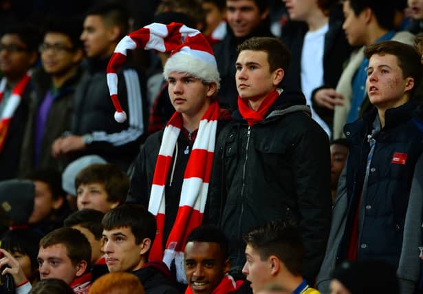 Arsenal fans look on during a home match against Everton in 2013. The score finished 1-1 that day with Ozil and Deulofeu grabbing the goals. (Getty Images)