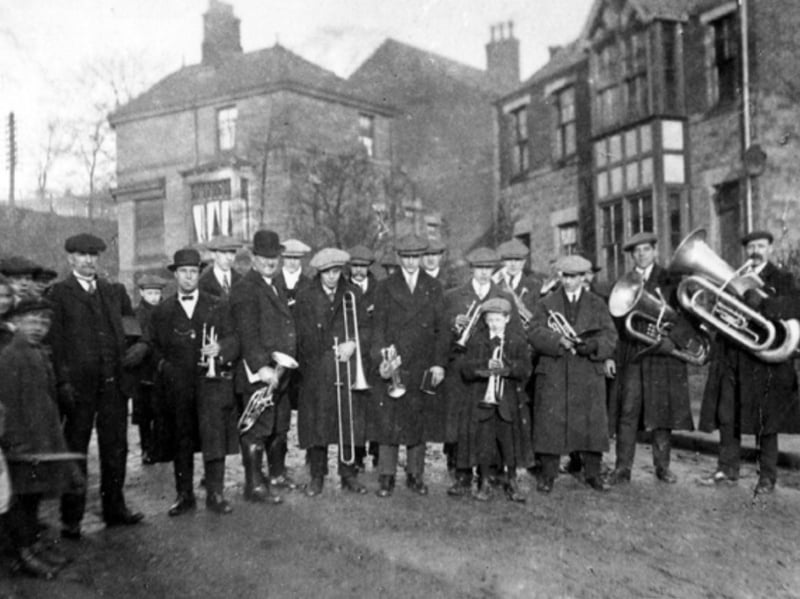 A brass band on Orchard Street, Oughtibridge, in around 1918