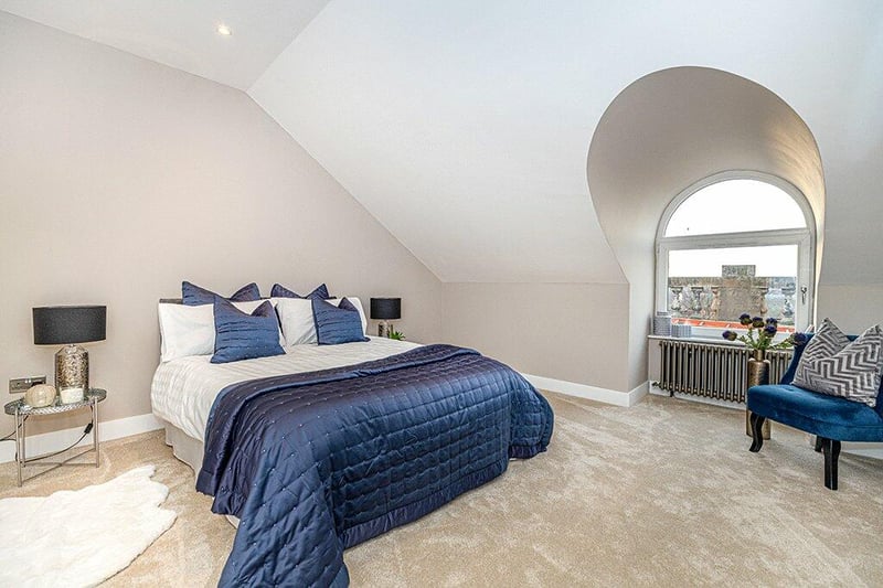 Bedroom two with charming arched window to the front with it being generous in size. 
