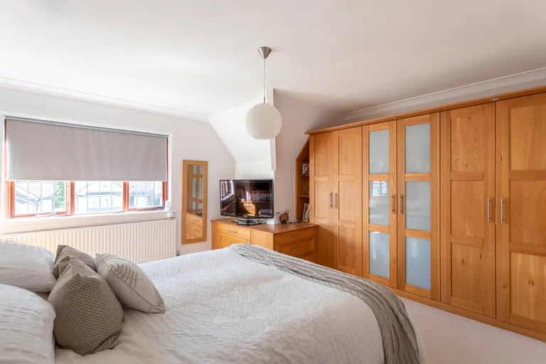 On the first floor is this stunning master suite with fitted wardrobes.