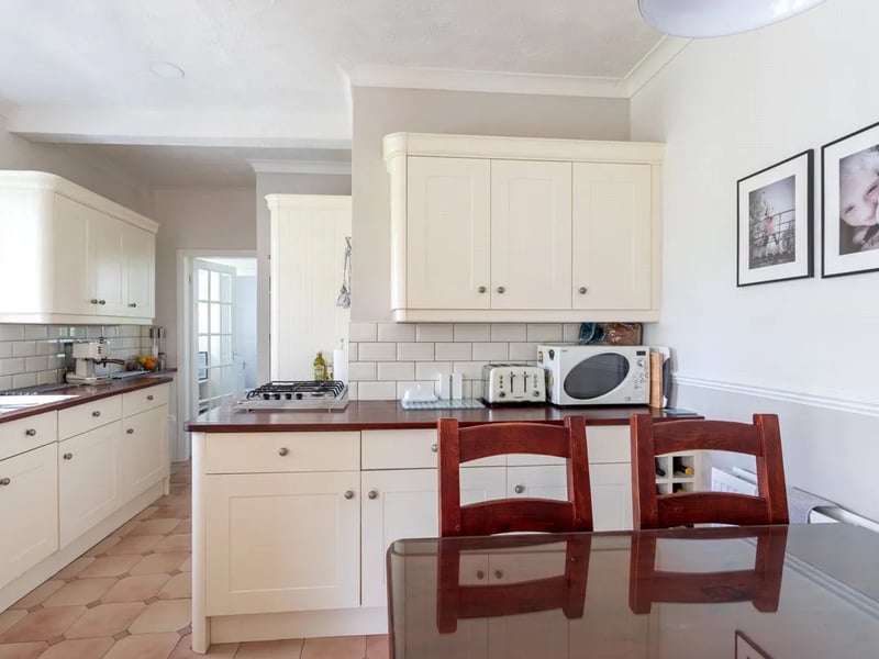 The kitchen has fitted base and wall units and lots of work space.