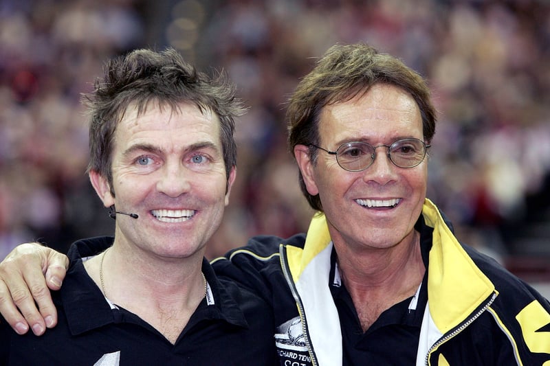 Sir Cliff Richard and actor Bradley Walsh take part in the "Intelligent Finance Cliff Richard Tennis Classic" at Birmingham National Indoor Arena on December 18, 2004 in Birmingham, England. The annual tournament raises money for the Cliff Richard Tennis Foundation, which introduces children across the country to the game. (Photo by MJ Kim/Getty Image