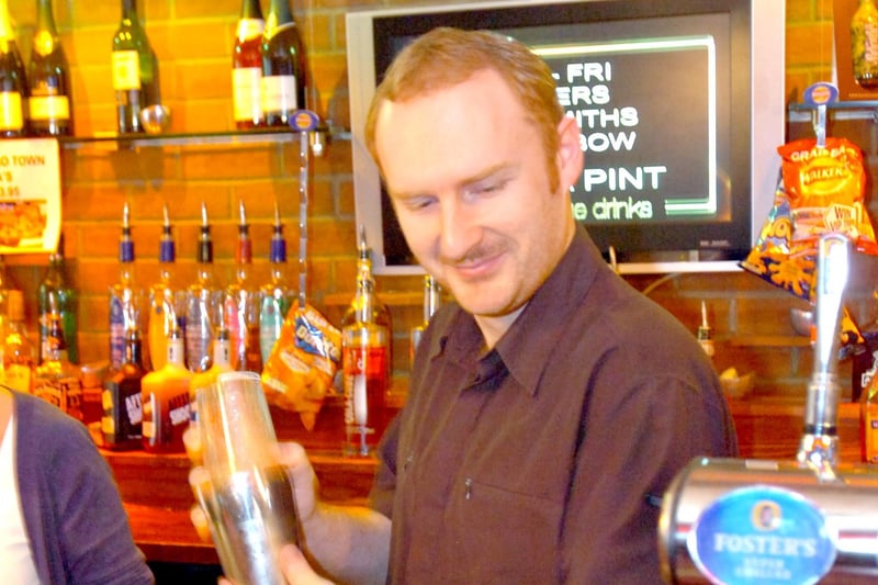 Darren Cook makes a cocktail at the Low Row pub in 2009.