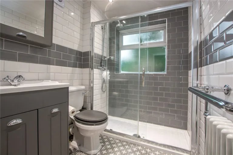 The modern three-piece family suite has  a large walk-in shower.