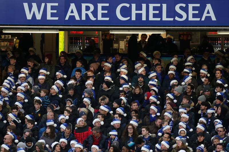 Fans of Chelsea wearing blue santa hats during the Premier League match between Chelsea and Southampton.