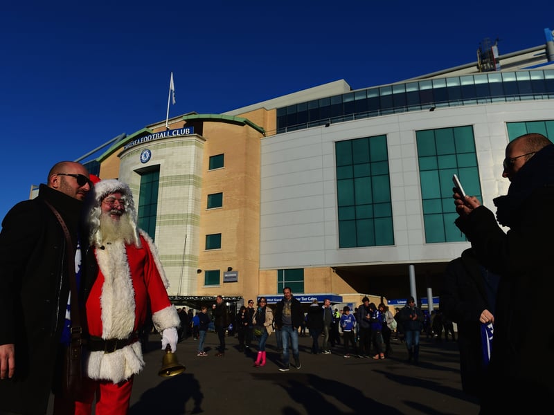 Fans pose with 'Father Christmas' prior to the Barclays Premier League match between Chelsea and Hull City
